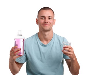 Photo of Man with bottle and glass of mouthwash on white background