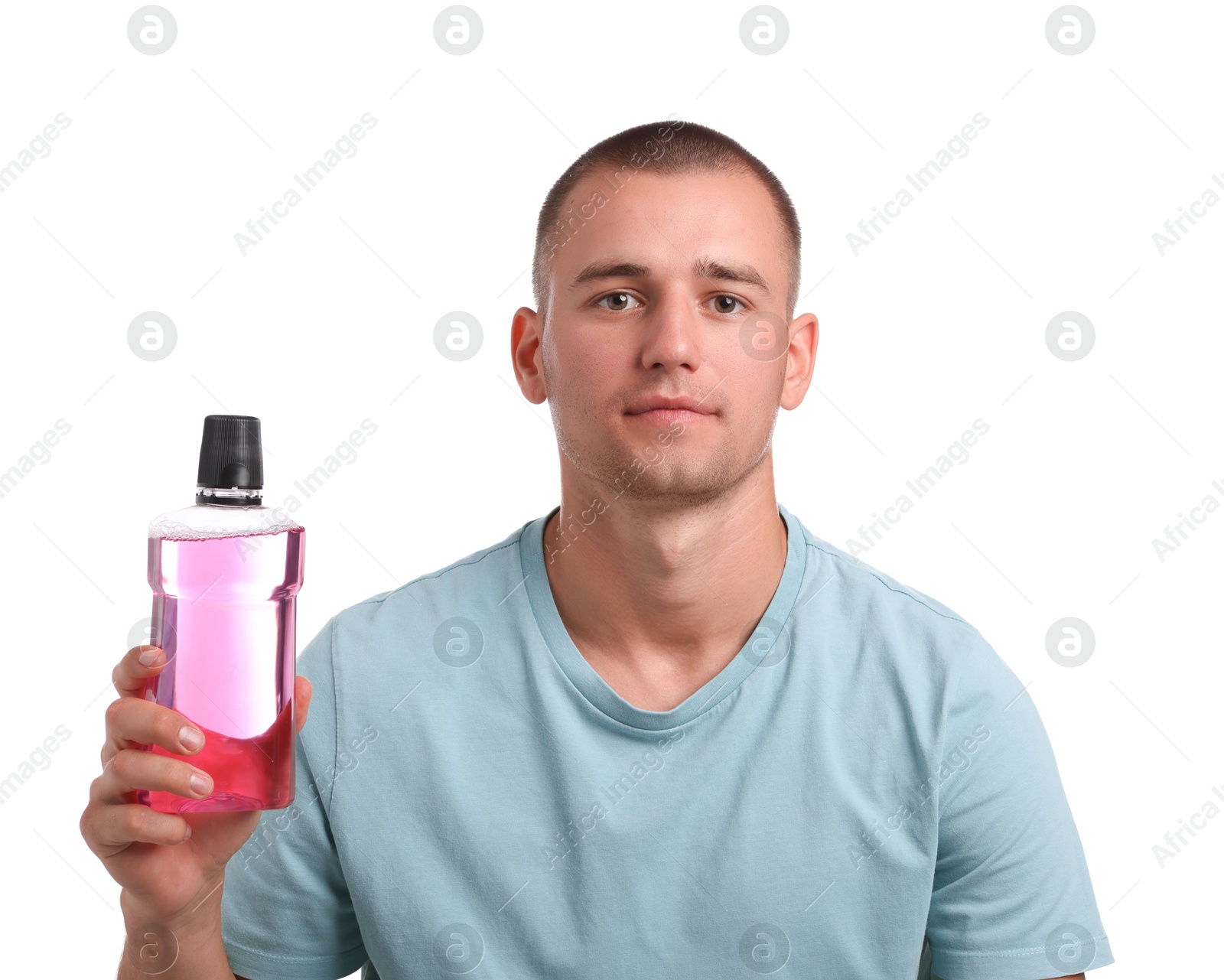 Photo of Man with bottle of mouthwash on white background