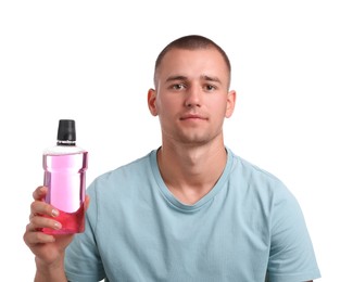 Photo of Man with bottle of mouthwash on white background