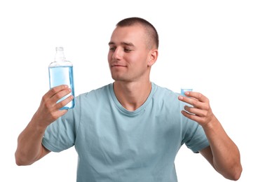 Photo of Man with bottle and cap of mouthwash on white background