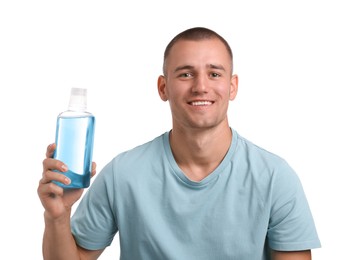 Photo of Man with bottle of mouthwash on white background
