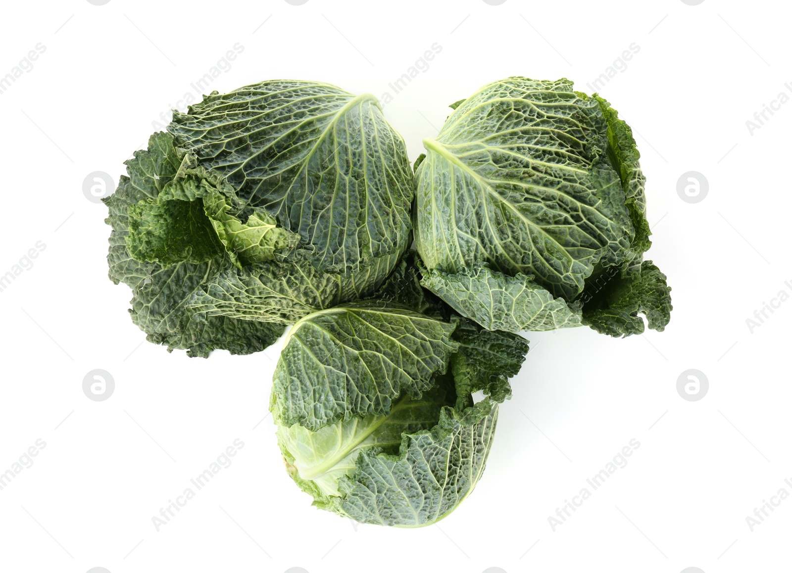 Photo of Fresh ripe Savoy cabbages isolated on white, top view