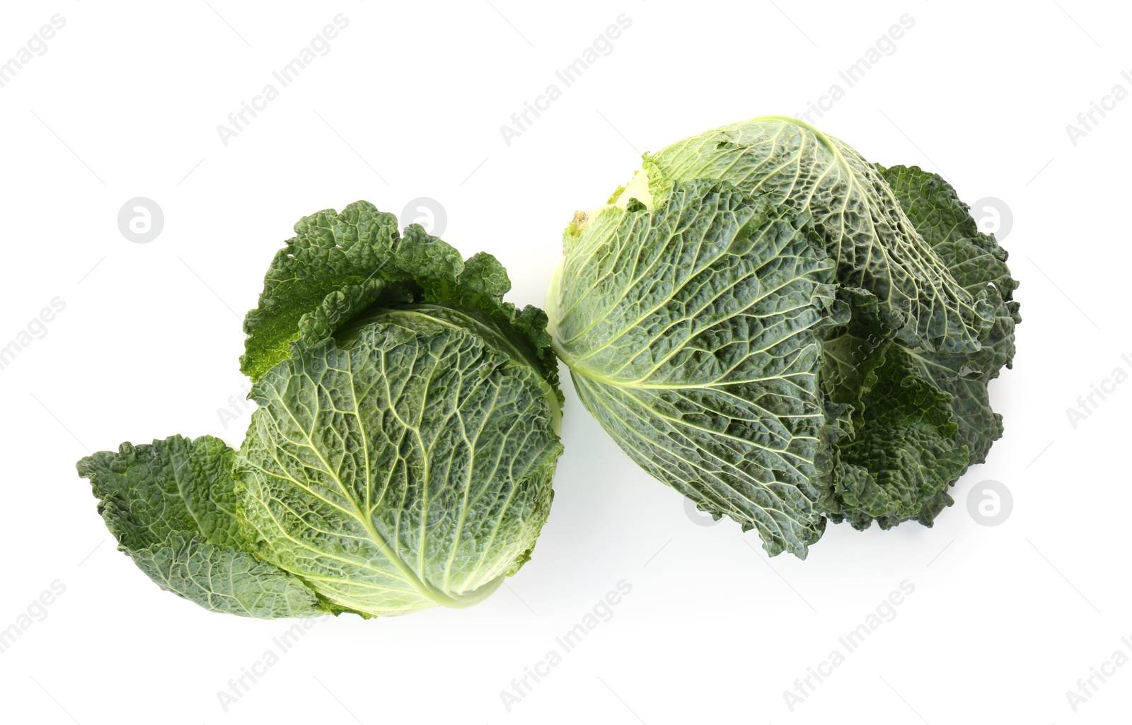 Photo of Fresh ripe Savoy cabbages isolated on white, top view