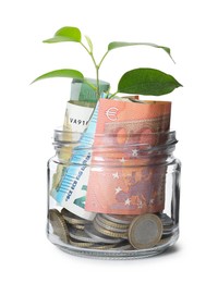 Photo of Glass jar with money and sprout isolated on white