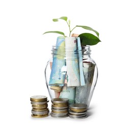 Photo of Glass jar with money and sprout isolated on white