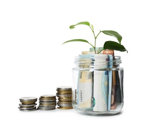 Photo of Glass jar with money and sprout isolated on white