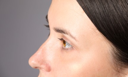 Photo of Woman with beautiful eyes on light grey background, closeup