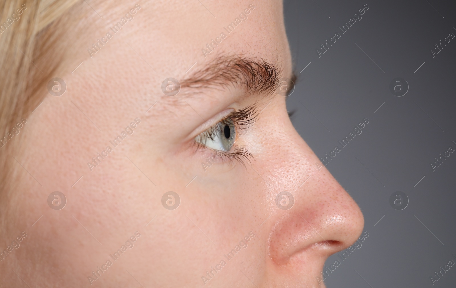 Photo of Woman with beautiful eyes on light grey background, closeup