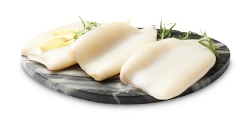 Photo of Uncooked squids with rosemary and lemon slices isolated on white