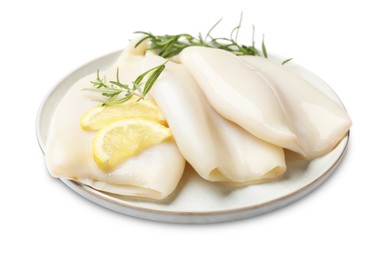 Photo of Uncooked squids with rosemary and lemon slices isolated on white