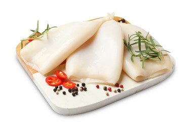 Photo of Uncooked squids with spices isolated on white