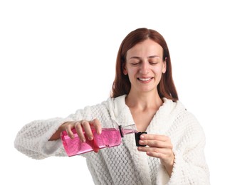 Photo of Woman rinsing mouth with mouthwash on white background