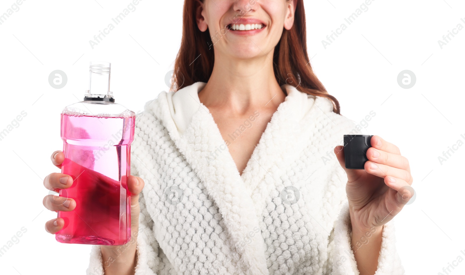 Photo of Woman rinsing mouth with mouthwash on white background, closeup