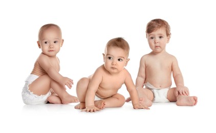 Image of Adorable babies in diapers on white background