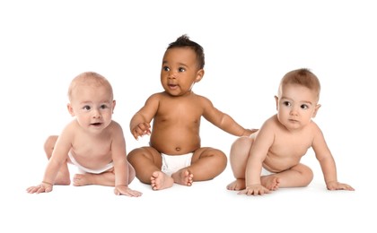 Image of Adorable babies in diapers on white background