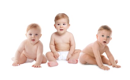 Image of Adorable babies in diapers on white background