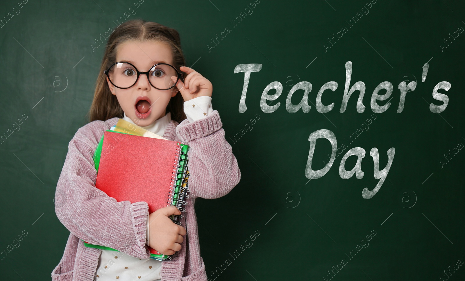 Happy Teacher's Day. Amused little girl with eyeglasses near green chalkboard Image of Happy Teacher's Day. Amused little girl with eyeglasses near green chalkboard