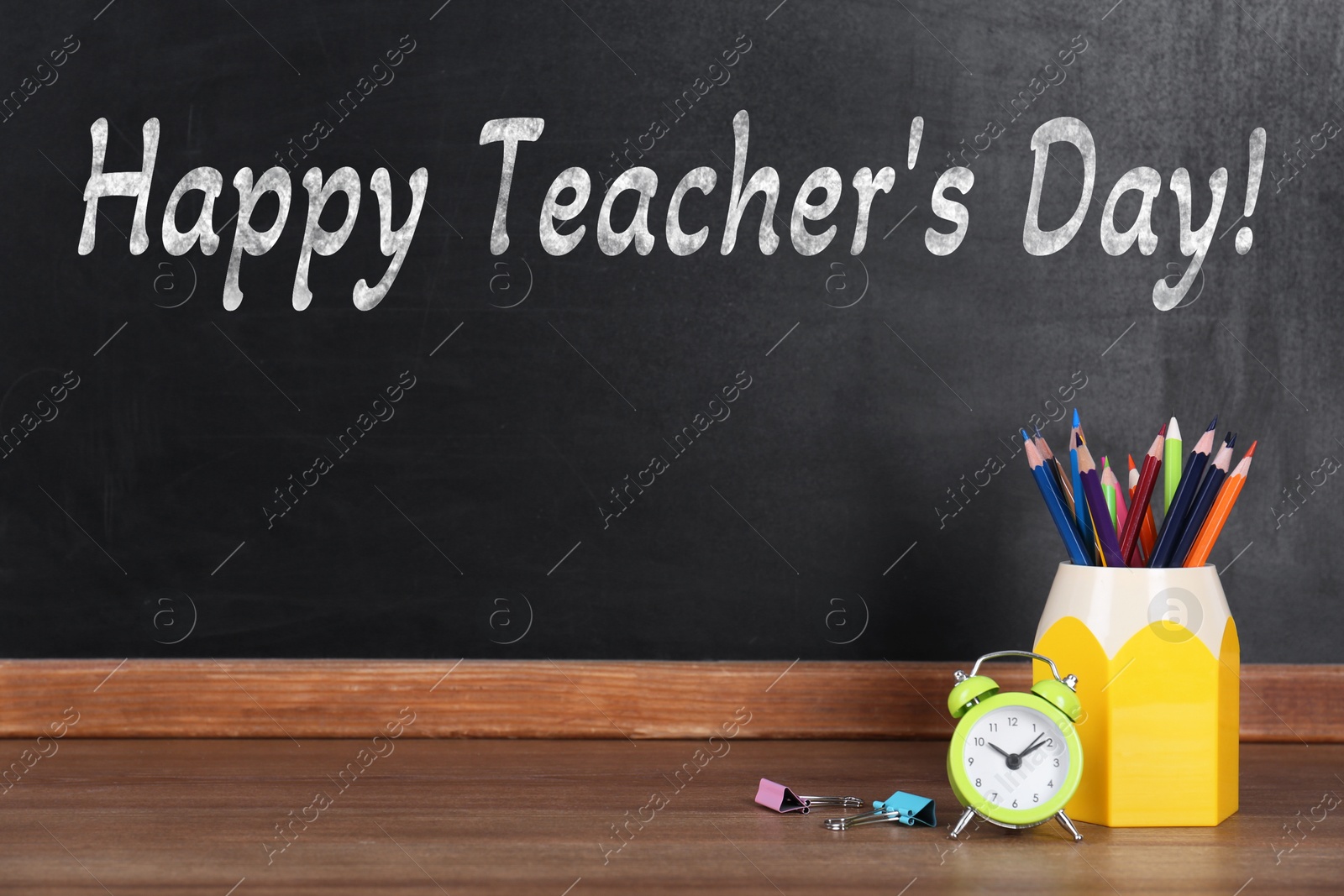 Image of Happy Teacher's Day greeting card. Blackboard with text and stationery