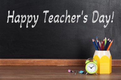 Image of Happy Teacher's Day greeting card. Blackboard with text and stationery