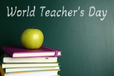Image of Happy Teacher's Day greeting card with books and text on green chalkboard
