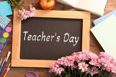 Image of Happy Teacher's Day greeting card with flowers and text on small chalkboard