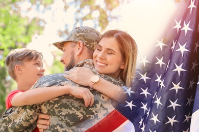 Image of Military man and his family outdoors, double exposure with national flag of USA