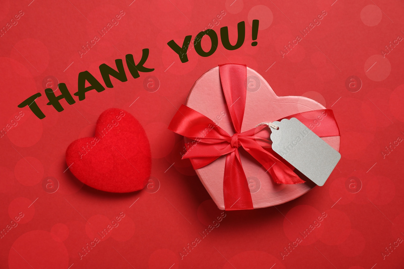Image of Thank you card design with heart-shaped gift box on red background. Bokeh effect