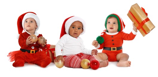 Image of Cute babies in Christmas clothes on white background
