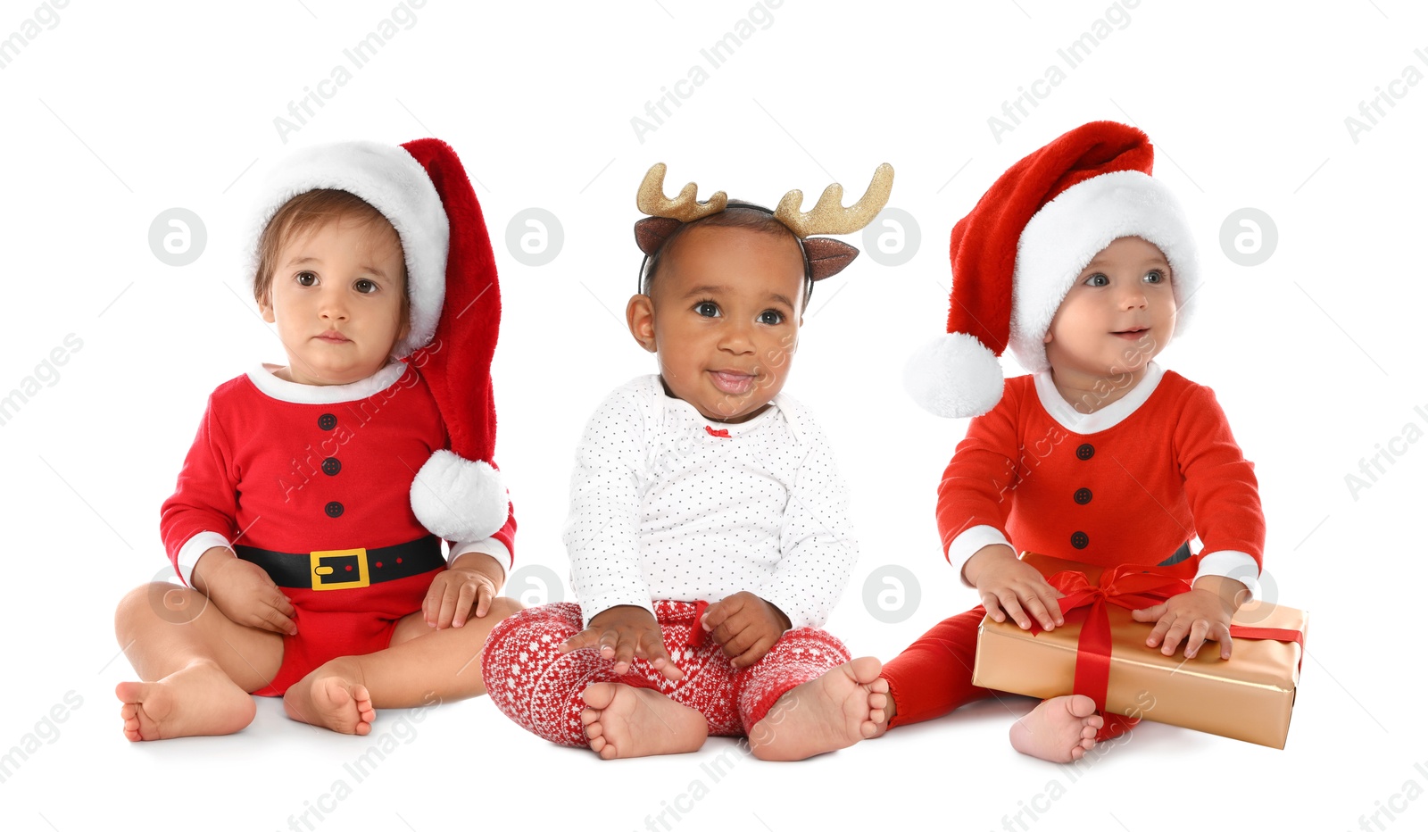 Image of Cute babies in Christmas clothes on white background
