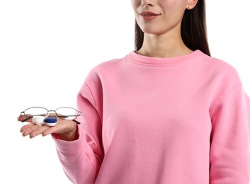 Photo of Woman choosing between glasses and contact lenses on white background, closeup