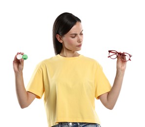 Photo of Woman choosing between glasses and contact lenses on white background