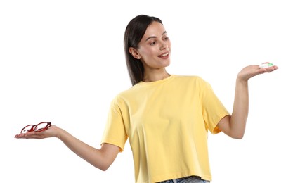 Photo of Woman choosing between glasses and contact lenses on white background