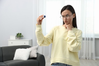 Photo of Woman in glasses with contact lenses indoors, space for text