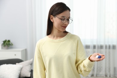 Photo of Woman in glasses with contact lenses indoors