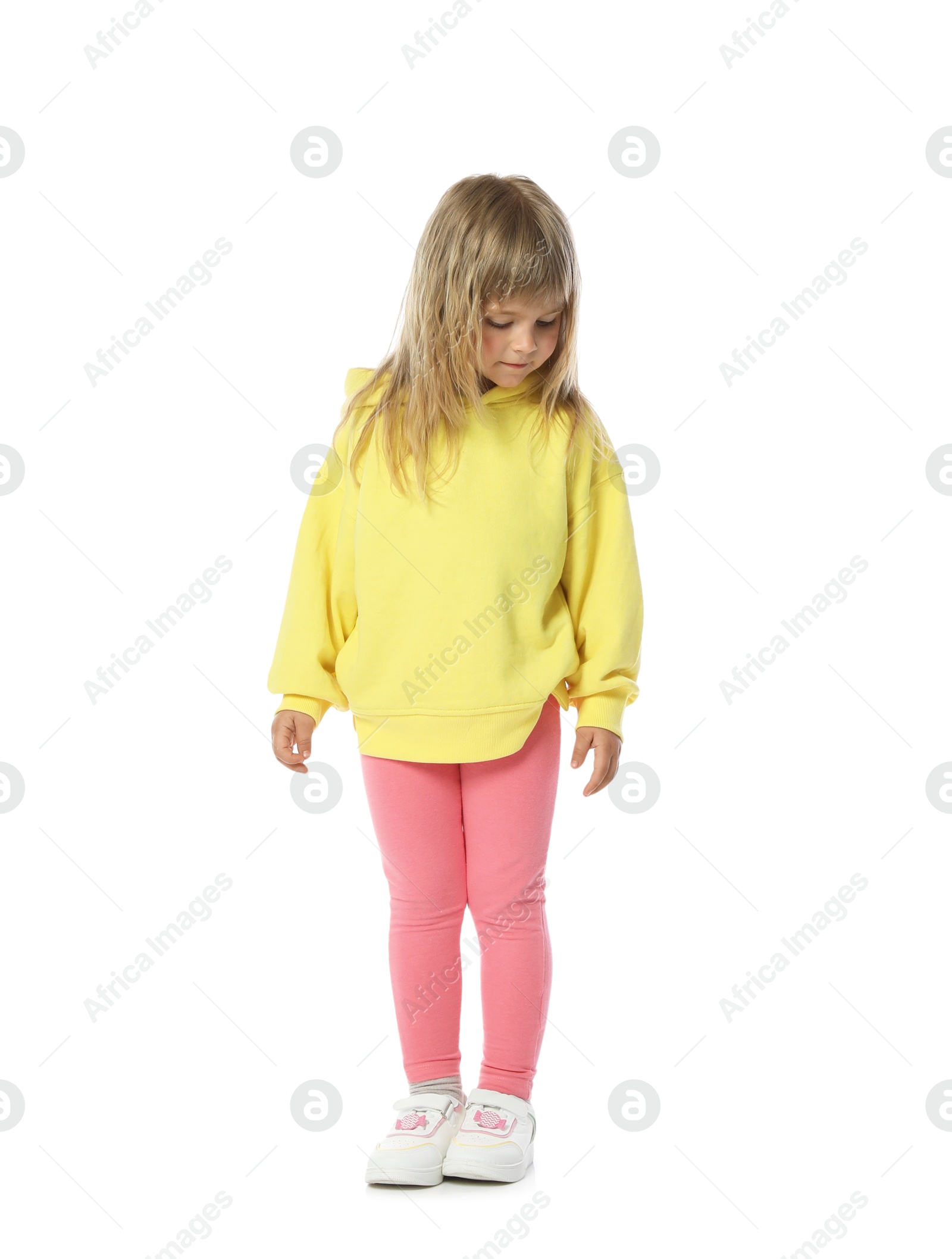 Photo of Cute little dancer posing on white background