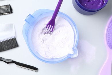 Photo of Hair care product for blonde hair and hairdresser's tools on white background, flat lay