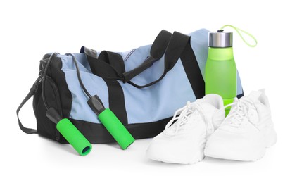Photo of Stylish bag with sports equipment isolated on white