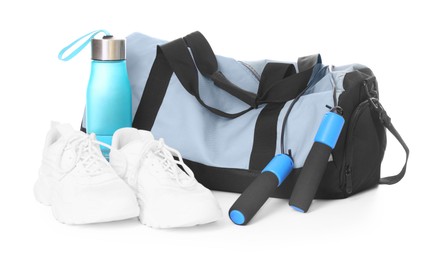 Photo of Stylish bag with sports equipment isolated on white