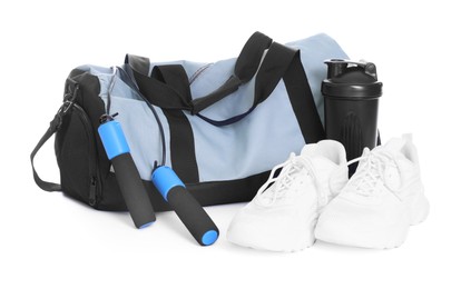 Photo of Stylish bag with sports equipment isolated on white