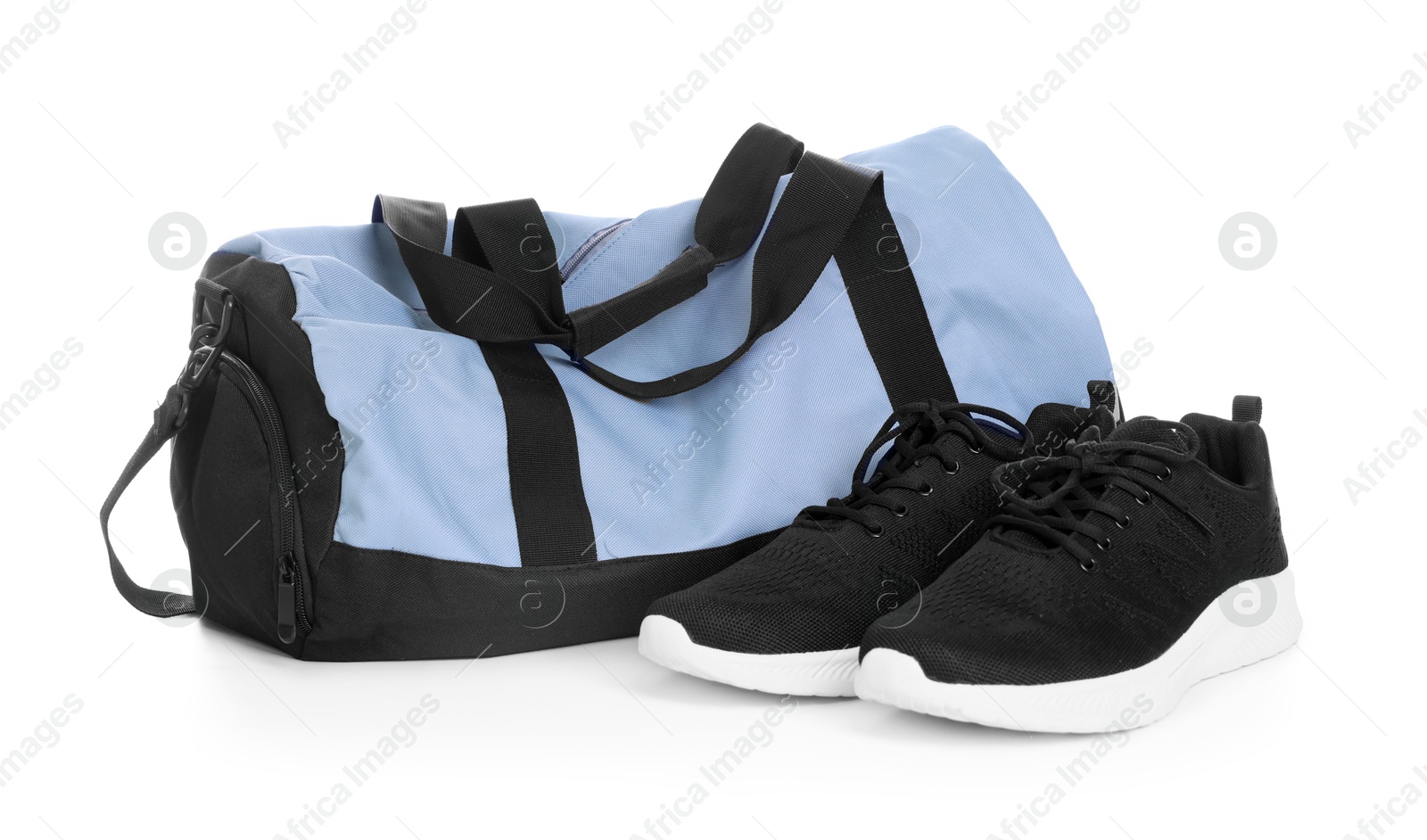 Photo of Stylish bag with sports equipment isolated on white