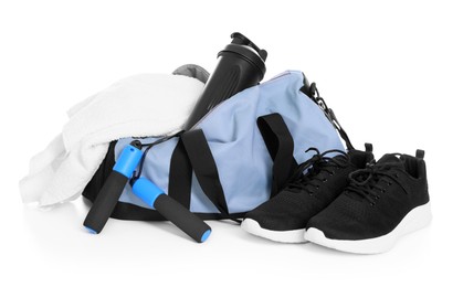 Photo of Stylish bag with sports equipment isolated on white