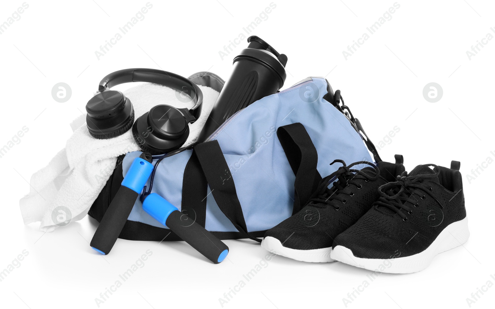 Photo of Stylish bag with sports equipment isolated on white