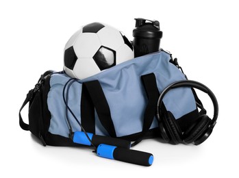 Photo of Stylish bag with sports equipment isolated on white