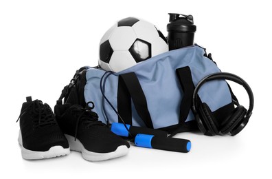 Photo of Stylish bag with sports equipment isolated on white