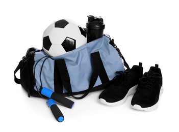 Photo of Stylish bag with sports equipment isolated on white