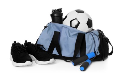 Photo of Stylish bag with sports equipment isolated on white