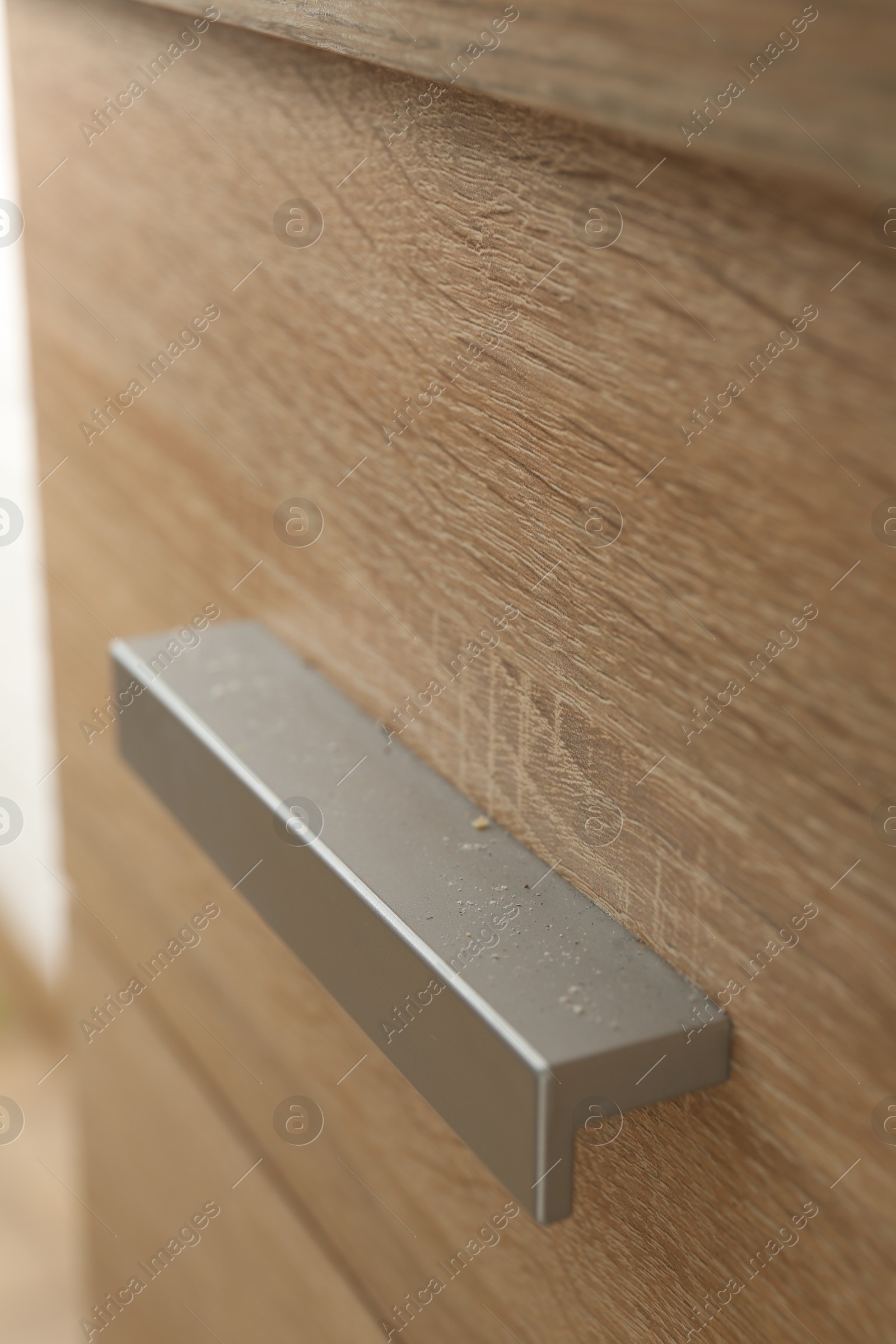 Handle of dresser covered with dust indoors, closeup Photo of Handle of dresser covered with dust indoors, closeup