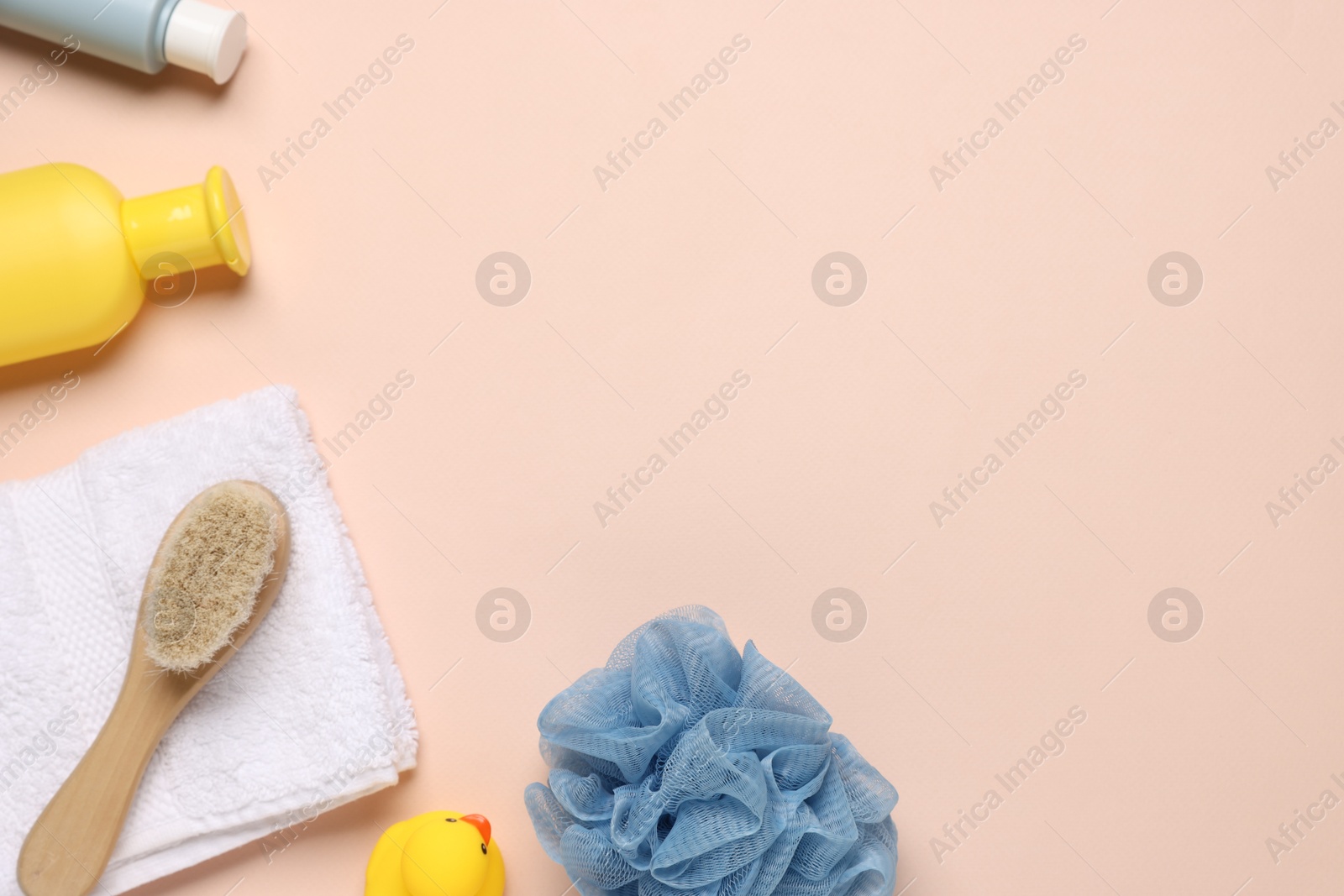 Photo of Baby bath accessories and cosmetic products on pink background, flat lay. Space for text