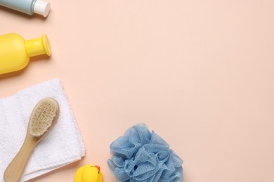 Photo of Baby bath accessories and cosmetic products on pink background, flat lay. Space for text