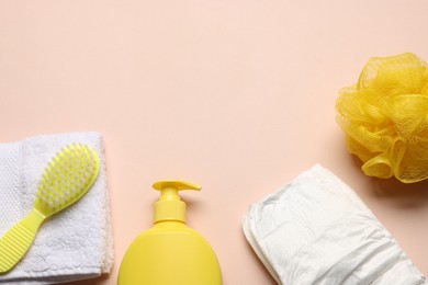 Photo of Baby bath accessories and diaper on pink background, flat lay. Space for text